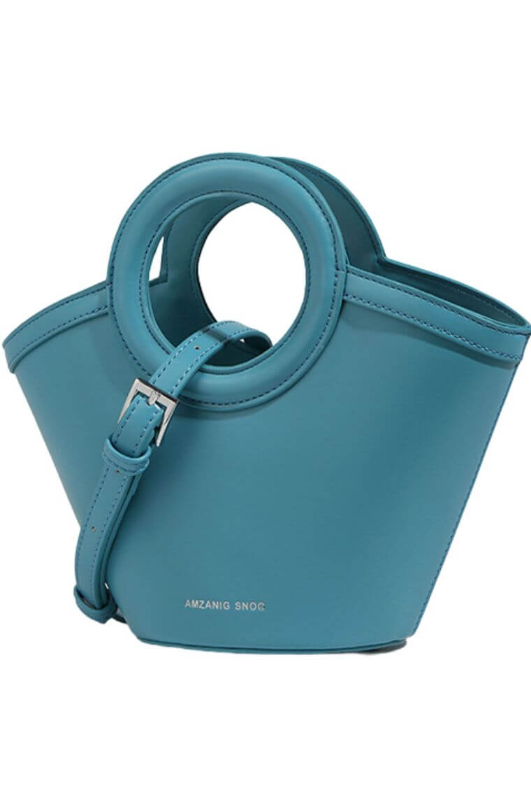 ladies small bag in turquoise with crossbody strap & top handles with small pouch